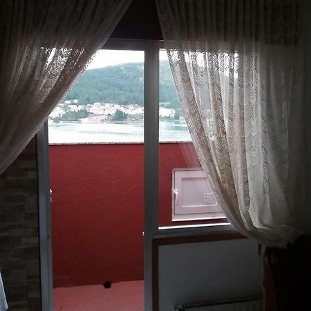 Atico Vacacional Apartment Muros Exterior photo